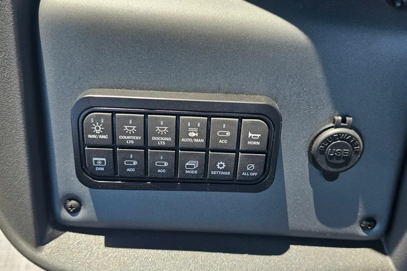 Slide: The Image of Control panel of 2026 Sun Tracker SportFish 20 DLX with various function buttons and USB port. - 15