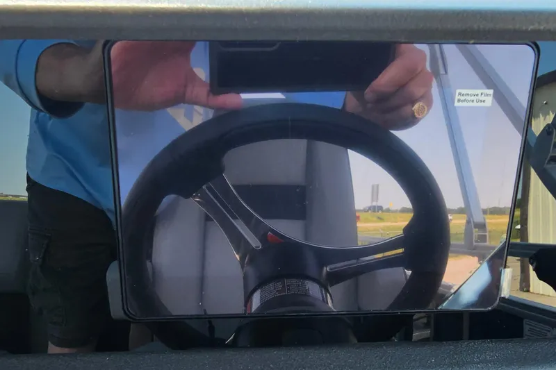 Slide: The Image of 2026 Sun Tracker SportFish 20 DLX steering wheel with protective film. - 16