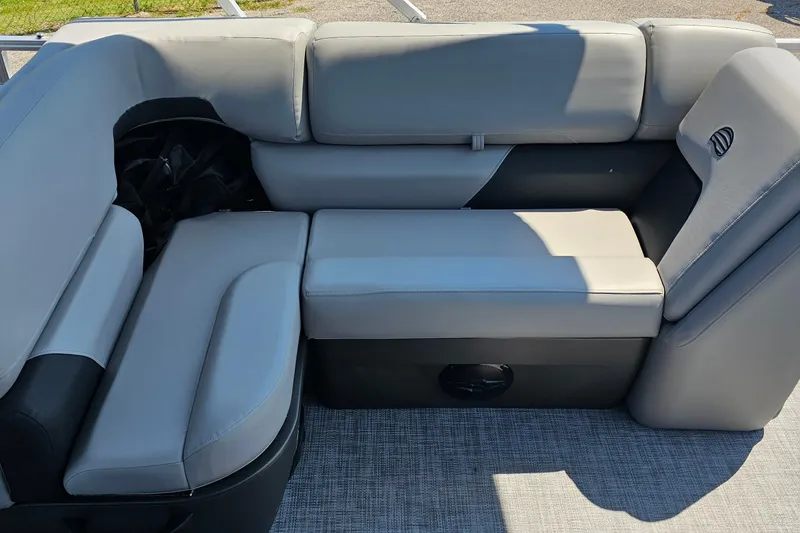 Slide: The Image of 2026 Sun Tracker SportFish 20 DLX boat interior with gray cushioned seating. - 17