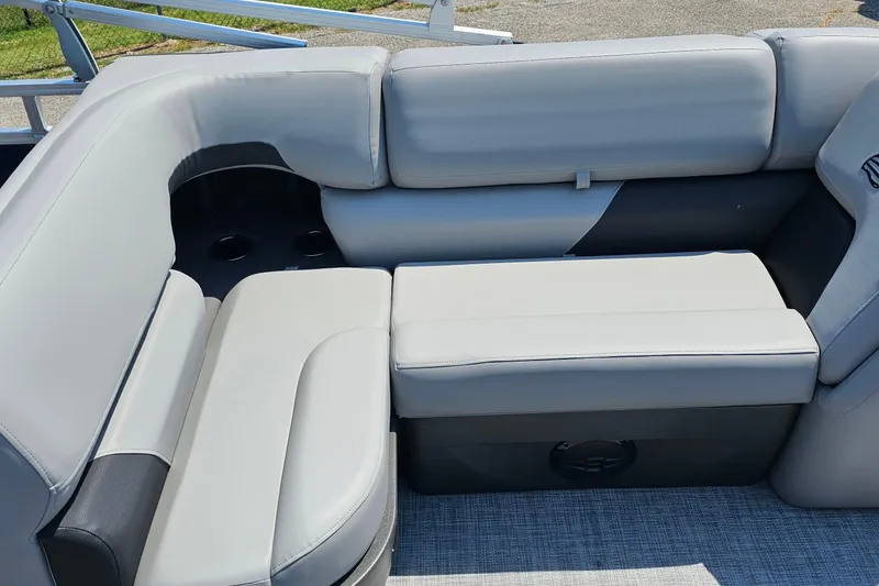Slide: The Image of 2026 Sun Tracker SportFish 20 DLX boat interior with gray cushioned seating. - 18