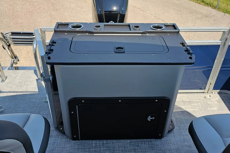 Slide: The Image of 2026 Sun Tracker SportFish 20 DLX boat interior with storage compartment and seating. - 19