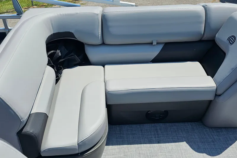 Slide: The Image of 2026 Sun Tracker SportFish 20 DLX boat interior with gray cushioned seating. - 20