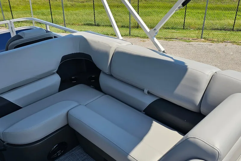 Slide: The Image of 2026 Sun Tracker SportFish 20 DLX boat interior with gray cushioned seating. - 9