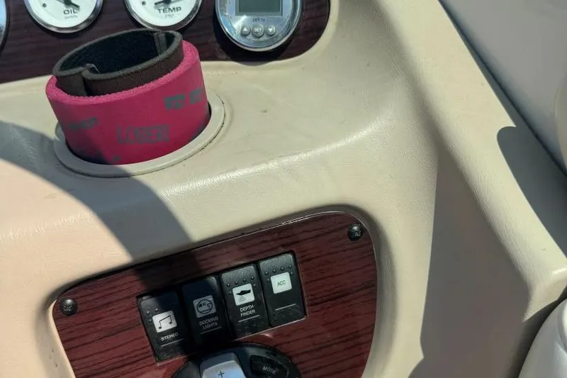 Slide: The Image of Dashboard of a 2001 Chaparral 220 SSi boat with controls and gauges. - 15