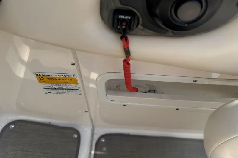 Slide: The Image of 2001 Chaparral 220 SSi boat interior with capacity label and safety lanyard. - 18