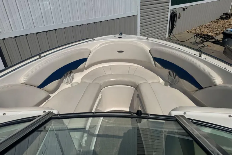 Slide: The Image of 2001 Chaparral 220 SSi boat interior with white and blue seating. - 23