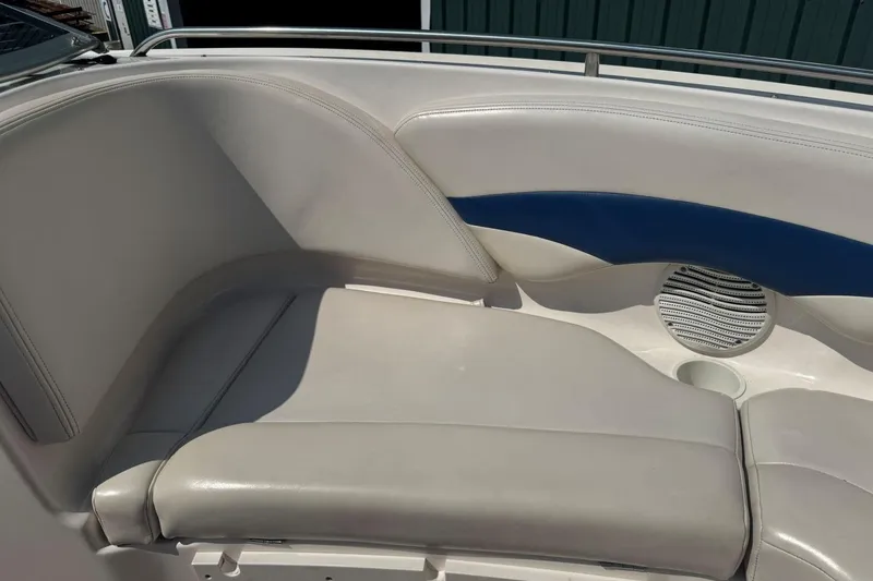 Slide: The Image of 2001 Chaparral 220 SSi boat interior with white and blue cushioned seating. - 28