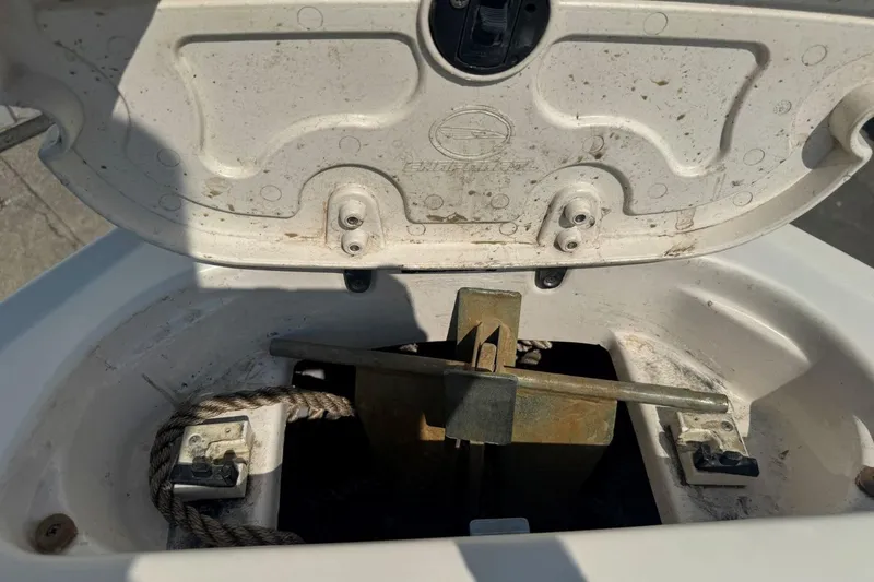 Slide: The Image of Anchor compartment of 2001 Chaparral 220 SSi boat with open hatch and visible rope. - 31