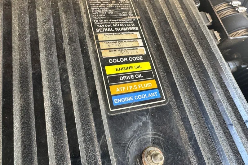 Slide: The Image of Engine compartment of 2001 Chaparral 220 SSi with fluid labels and serial numbers. - 36