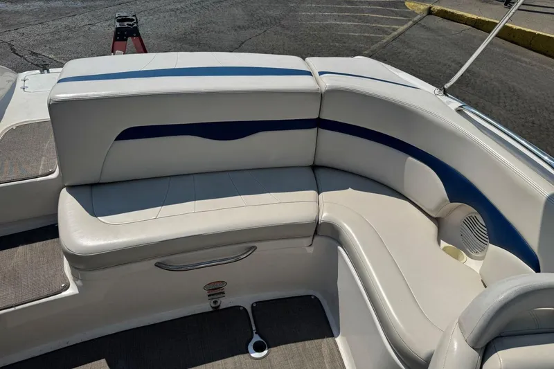Slide: The Image of 2001 Chaparral 220 SSi boat interior with white and blue cushioned seating. - 8