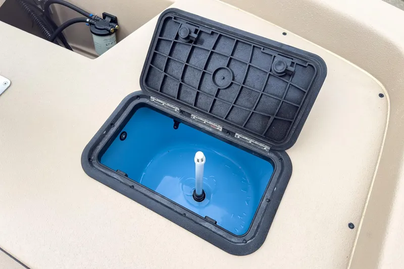 Slide: The Image of Open storage compartment on 2026 Carolina Skiff E21 DLX CC boat. - 10