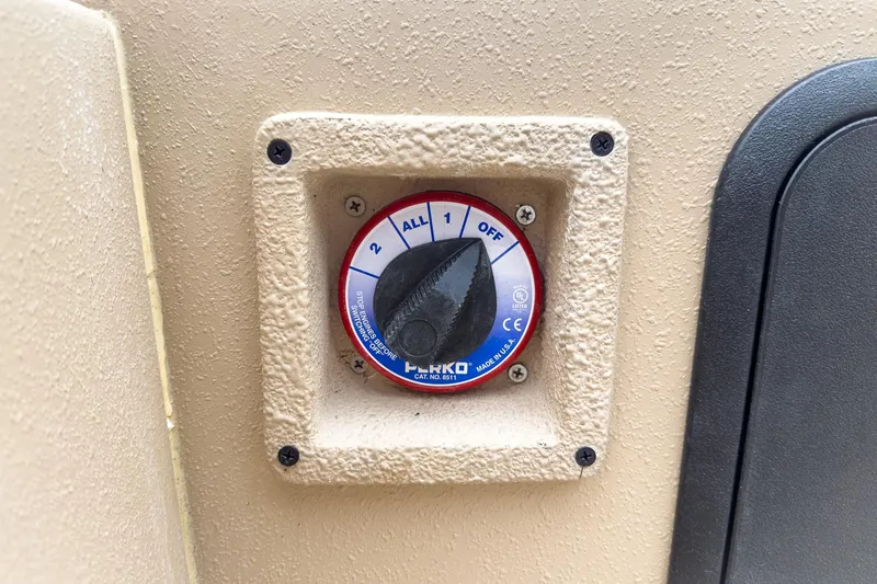 Slide: The Image of Battery switch on 2026 Carolina Skiff E21 DLX CC boat dashboard. - 17