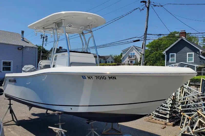 Slide: The Image of 2018 Release 208RX boat on trailer in residential area. - 0