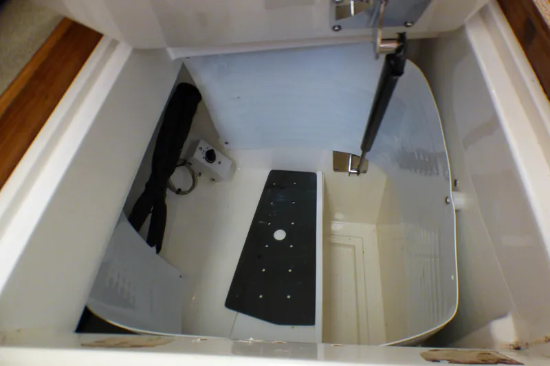 Slide: The Image of Storage compartment of a 1993 Hunter 40.5 sailboat, featuring organized interior space. - 29