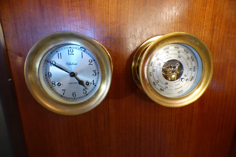 Slide: The Image of Brass clock and barometer on 1993 Hunter 40.5 yacht's wooden interior. - 32