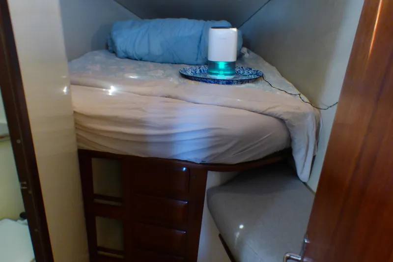 Slide: The Image of Cozy cabin interior of 1993 Hunter 40.5 sailboat with bed and storage. - 40