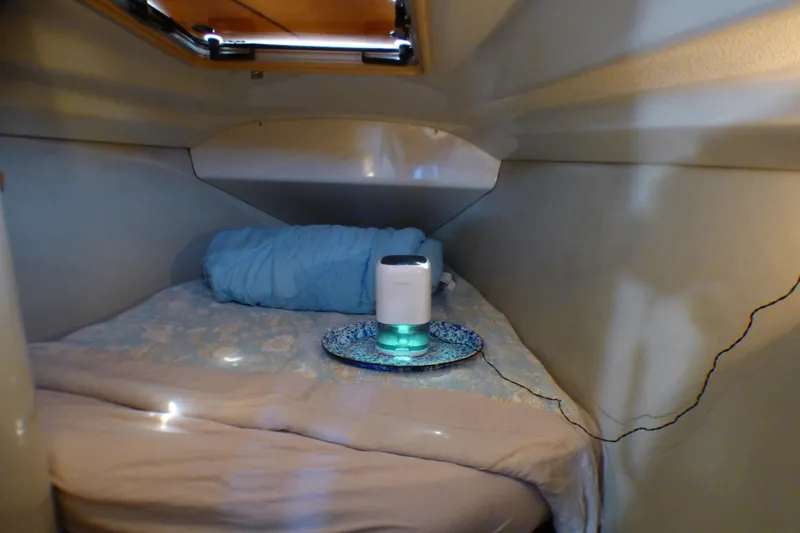Slide: The Image of Cozy cabin interior of 1993 Hunter 40.5 sailboat with bedding and small appliance. - 41