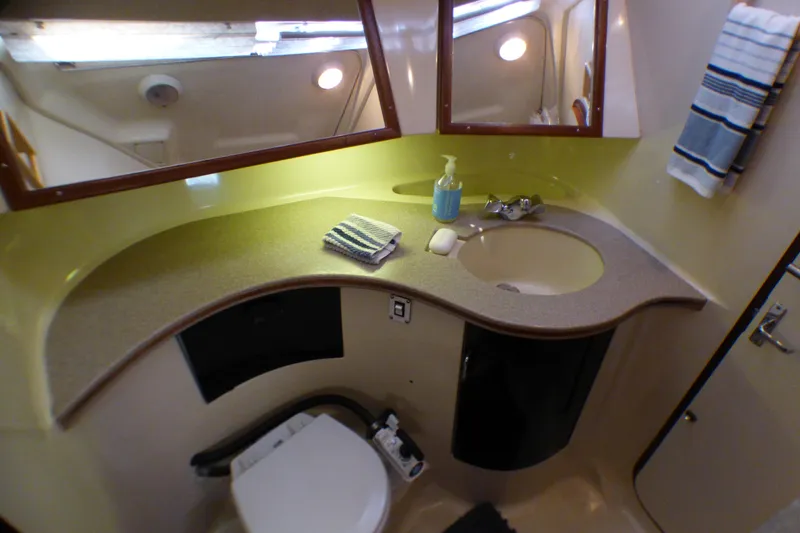 Slide: The Image of Bathroom interior of 1993 Hunter 40.5 yacht with sink, mirror, and toilet. - 43