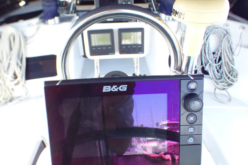 Slide: The Image of Cockpit of 1993 Hunter 40.5 sailboat with B&G navigation system and Garmin equipment. - 48