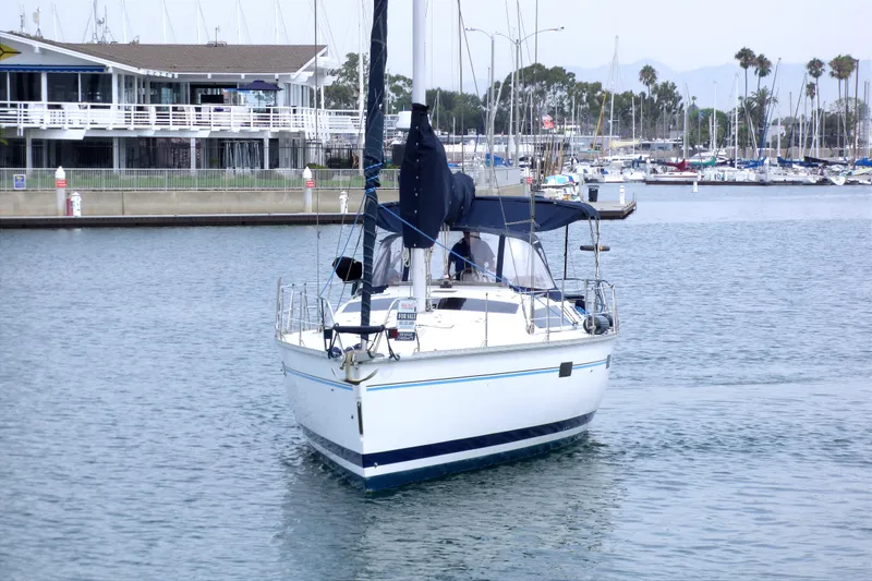 Slide: The Image of Sailboat Hunter 40.5, 1993 model, docked in marina with waterfront view. - 5