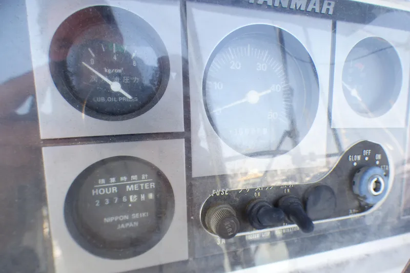 Slide: The Image of Close-up of a 1993 Hunter 40.5 engine control panel with gauges and hour meter. - 53