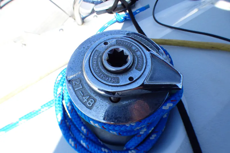 Slide: The Image of Winch on 1993 Hunter 40.5 sailboat with blue rope coiled around it. - 55