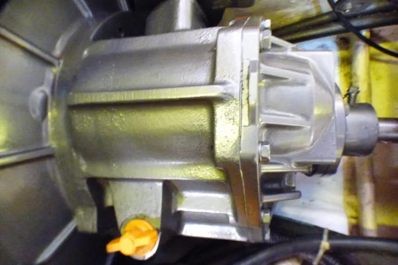 Slide: The Image of Close-up of a 1993 Hunter 40.5 engine component with metallic finish and orange valve. - 65