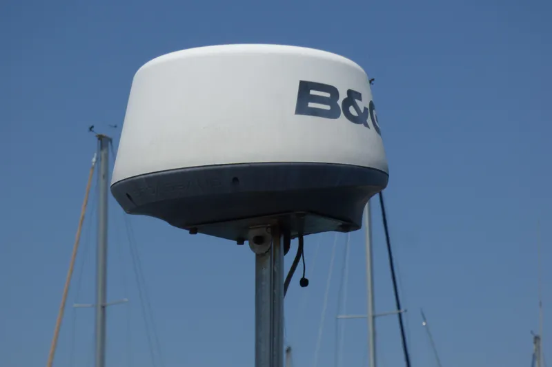 Slide: The Image of B&G radar on a 1993 Hunter 40.5 sailboat against a clear blue sky. - 67
