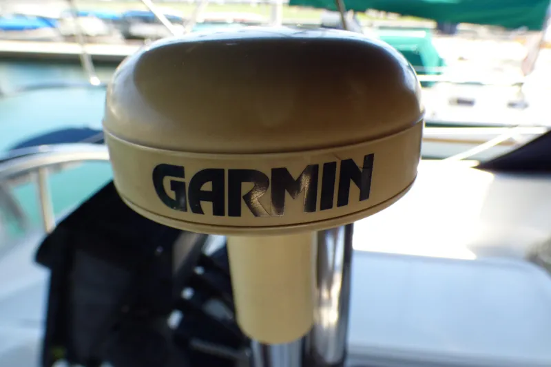 Slide: The Image of Garmin GPS device on a 1993 Hunter 40.5 sailboat, docked at a marina. - 68