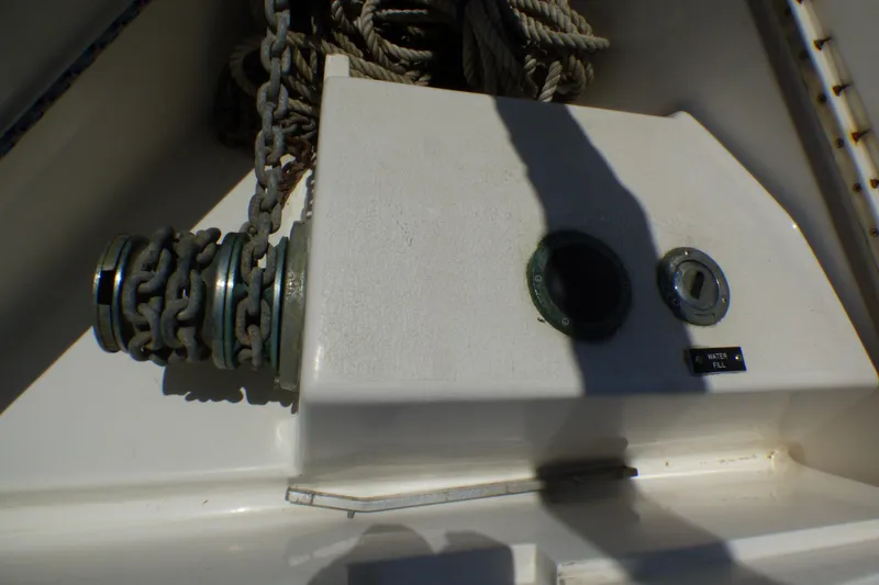 Slide: The Image of Anchor chain and water fill port on 1993 Hunter 40.5 sailboat deck. - 71