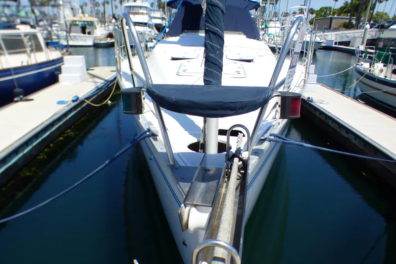 Slide: The Image of 1993 Hunter 40.5 sailboat docked in a marina, front view. - 9