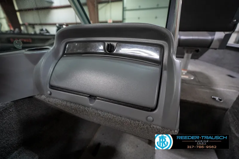 Slide: The Image of Interior of 2014 Lund 1650 Rebel XS boat, featuring a storage compartment. - 28