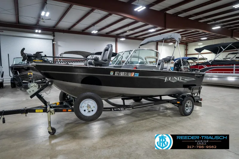 Slide: The Image of 2014 Lund 1650 Rebel XS boat on trailer in indoor showroom. - 3
