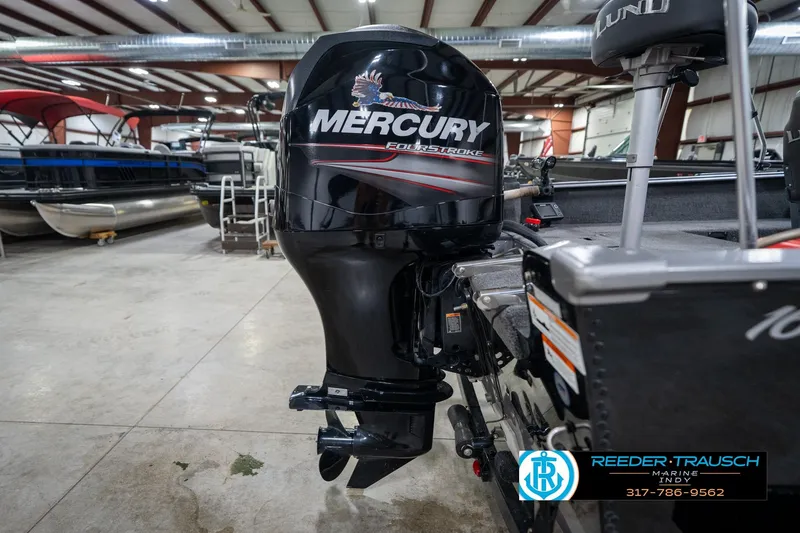 Slide: The Image of 2014 Lund 1650 Rebel XS with Mercury FourStroke engine in a showroom. - 56