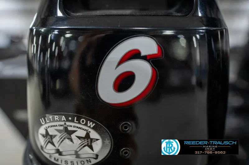 Slide: The Image of Close-up of a 2014 Lund 1650 Rebel XS outboard motor with ultra-low emission label. - 59