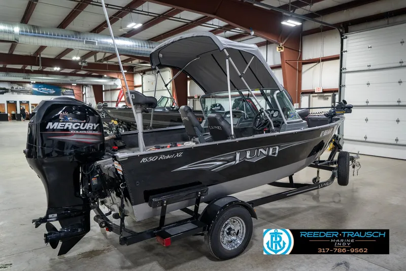 Slide: The Image of 2014 Lund 1650 Rebel XS boat with Mercury engine in showroom. - 8