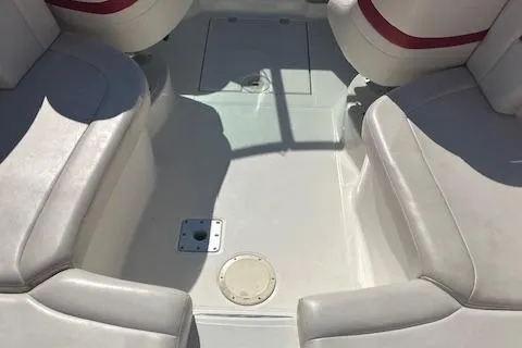 Slide: The Image of 2001 Chaparral 265 SSi boat interior with white seating and red accents. - 5