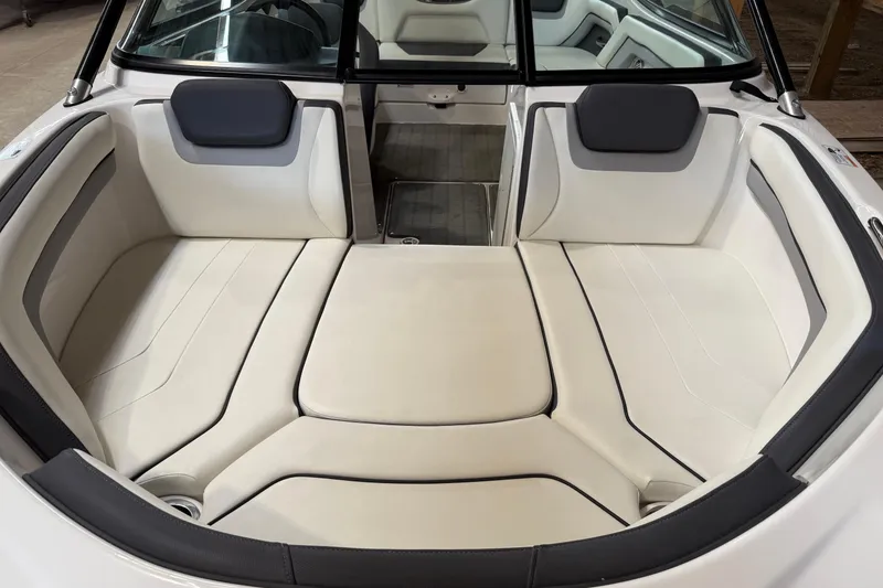 Slide: The Image of 2015 Yamaha Boats AR192 interior with white cushioned seating and sleek design. - 2