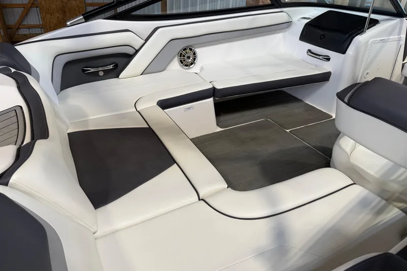 Slide: The Image of Interior of a 2015 Yamaha Boats AR192, featuring sleek white and black seating. - 3
