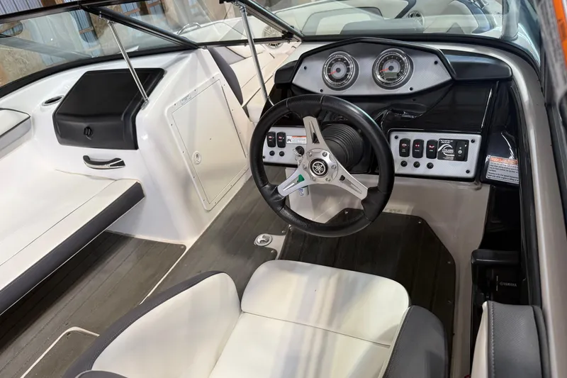 Slide: The Image of 2015 Yamaha Boats AR192 cockpit with steering wheel and dashboard controls. - 4