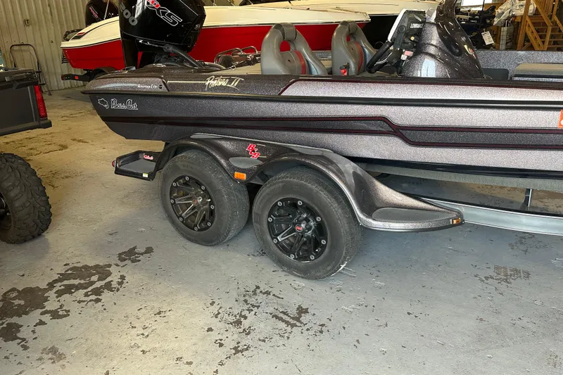Slide: The Image of 2021 Bass Cat Pantera II boat on trailer in garage setting. - 14