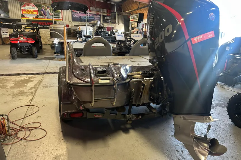 Slide: The Image of 2021 Bass Cat Pantera II boat with powerful outboard motor in showroom. - 15