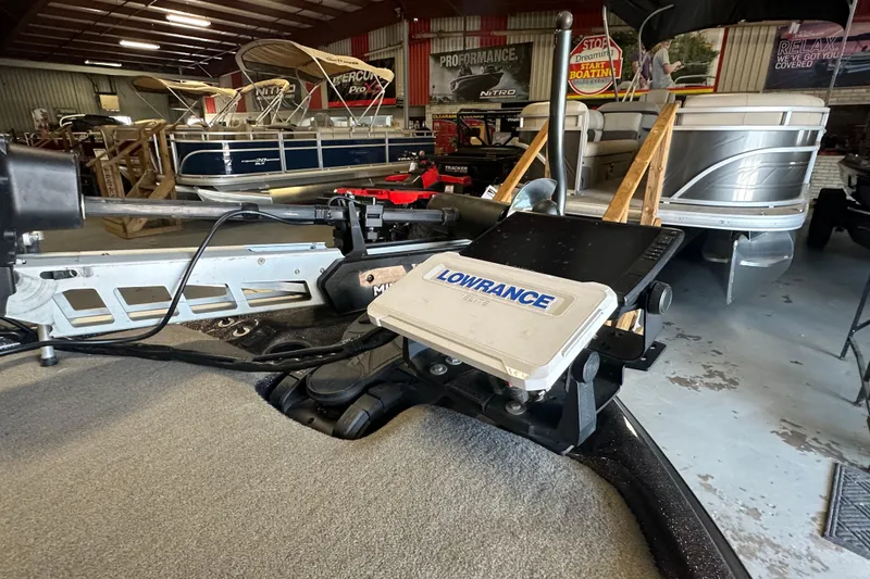 Slide: The Image of 2021 Bass Cat Pantera II boat with Lowrance electronics in a showroom. - 18