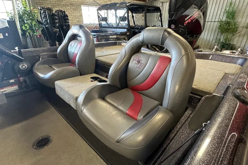 Slide: The Image of 2021 Bass Cat Pantera II boat interior with gray and red seats. - 22