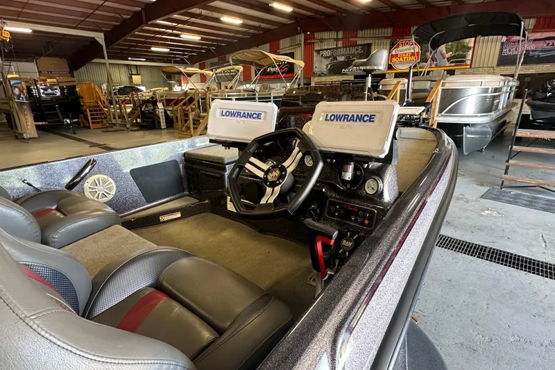 Slide: The Image of 2021 Bass Cat Pantera II boat interior with Lowrance electronics in a showroom. - 23