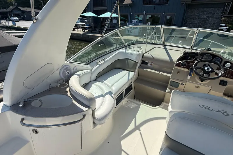 Slide: The Image of 2007 Sea Ray 260 Sundancer boat interior with helm, seating, and dashboard. - 6