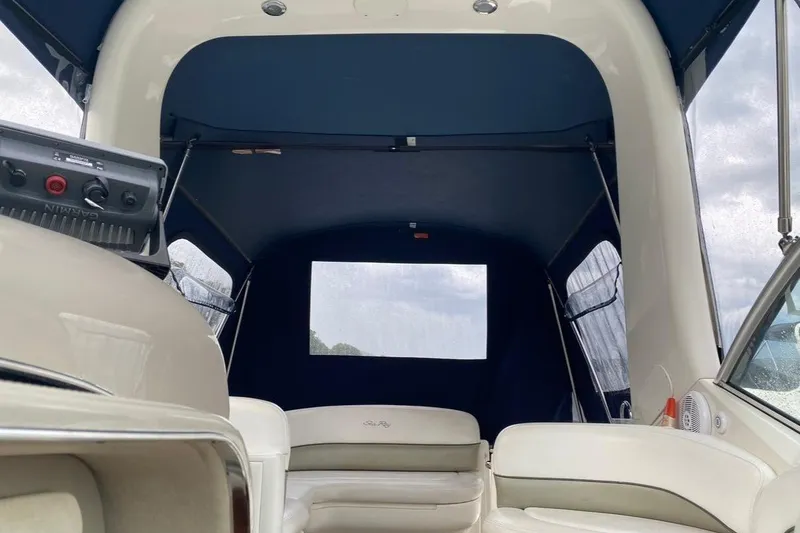 Slide: The Image of Interior view of 2007 Sea Ray 260 Sundancer boat with blue canopy. - 8
