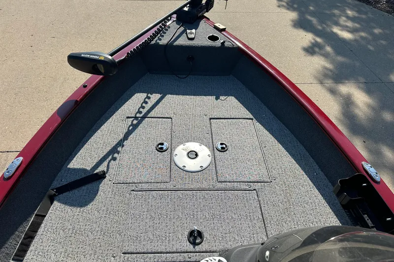 Slide: The Image of 2021 Tracker Super Guide V 16 SC boat deck with trolling motor and storage compartments. - 3