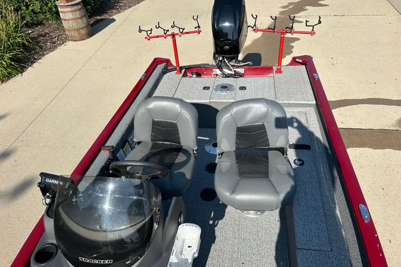 Slide: The Image of 2021 Tracker Super Guide V 16 SC fishing boat with dual seats and rod holders. - 5