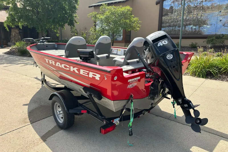Slide: The Image of 2013 Tracker Pro Guide V 16 T boat with Mercury 40 HP engine on trailer. - 2